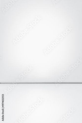 Empty white studio interior background with subtle texture and glossy floor. Ideal for product presentation, mock-ups, advertising, or text overlay.
