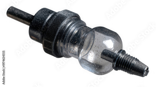 A close-up view of a small, clear, plastic valve with black metal fittings on a black background.