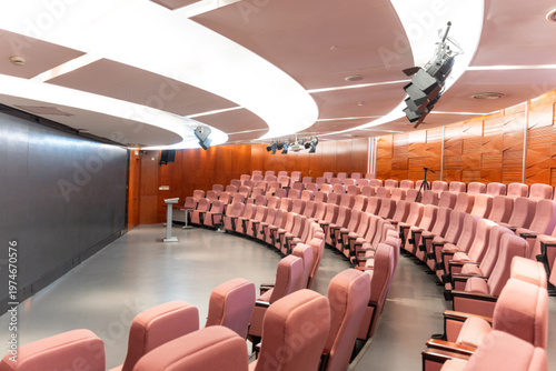 Schilderij op canvas Modern curved auditorium with empty seats and panoramic interior view