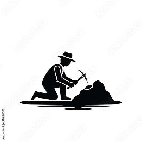 Black silhouette of prospector mining rock with pickaxe