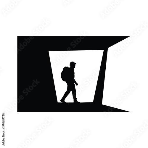 Silhouette of a traveler with backpack walking through a black and white frame
