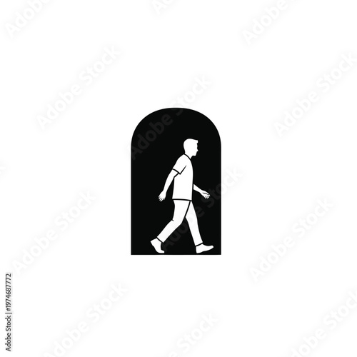 Silhouette of walking person on black background in archway