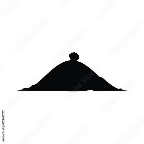 Black silhouette of a small figure sitting on of a hill