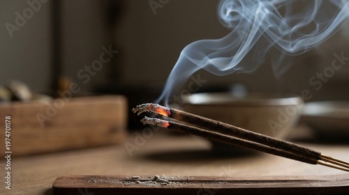 Incense Sticks Burning with Wisps of Smoke on a Wooden Stand