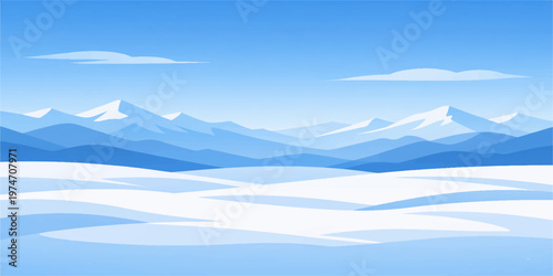 Snowy winter mountain landscape with blue sky, clouds, and mist over high peaks and valley