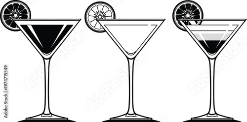 Stylish martini glasses with lemon slices and layered cocktails on a gray background.