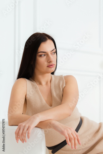 Calm confident woman portrait in bright minimalist interior