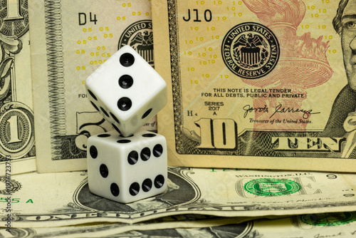 Dice In Balanced Formation Surrounded By Dollar Bills