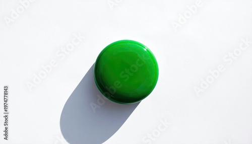 Minimalist Green Sphere Object Casting Shadow on Clean White Background.