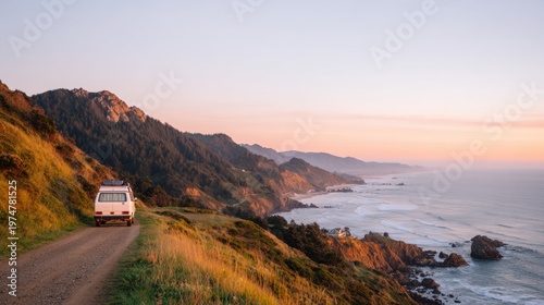 A vintage van parked on a winding coastal road with stunning mountains and ocean views at sunset