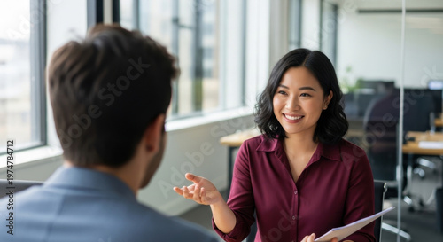 Young bank worker woman explaining working service process to client. Female hr reading cv talking with employee, business partner, working in office. People discussing project. Web banner, copy space