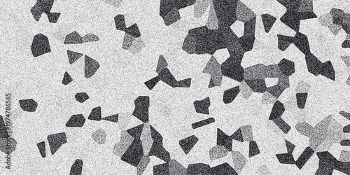 Abstract monochrome geometric mosaic pattern with granular texture and irregular polygonal shapes creating a dynamic visual effect