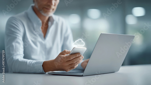 Businessman using smartphone and laptop for cloud computing, modern office, technology, digital data transfer, innovation concept