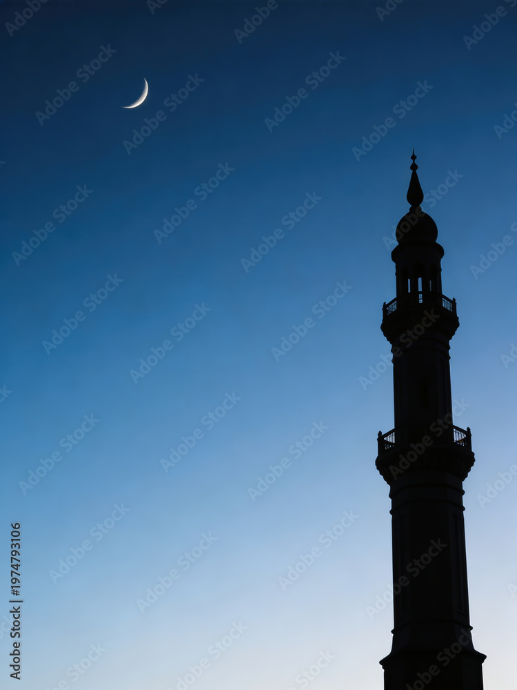 Fototapeta premium Crescent moon over silhouette of minaret against blue sky. Islamic architecture for Ramadan and Eid al-Adha greeting card.