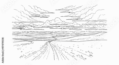A solitary road winds through a vast, cloud-filled prairie landscape