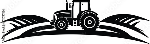 A black and white tractor plowing through a field with furrowed rows.