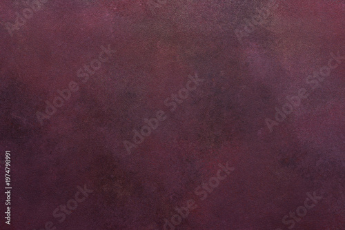 A dark maroon surface exhibits a subtle texture. Light and dark variations create a smooth, blended effect over the entire area