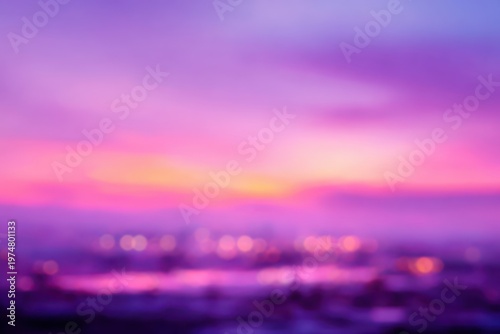 Vibrant Purple and Pink Sunset Sky Over a Blurred Cityscape with Bokeh Lights