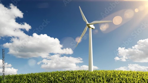 Wind turbine towering over lush green grass in a field under a sunny blue sky