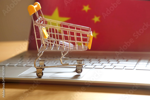 Online shopping and e-commerce in China; Shopping cart on computer with China flag