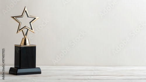 Father Day A black trophy with a silver outlined star on top standing on a wooden surface with a plain light background.