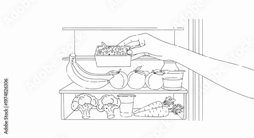 Hand places container of berries into a refrigerator with fresh produce
