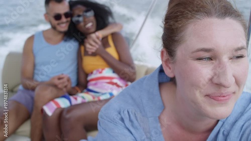 Wallpaper Mural A couple hugs each other as they ride on a boat full of their friends. Torontodigital.ca