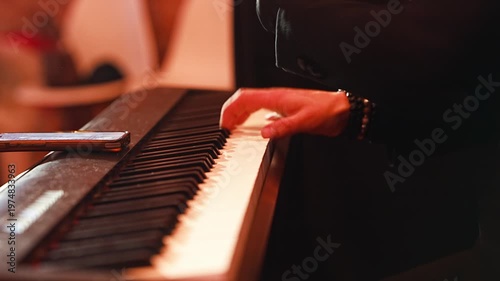 Bartender mixes cocktails during party with live music playing