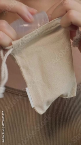 Sustainable Menstrual Product Handling. Women Managing Menstrual Cups Discreetly In Travel Containers. Ensuring Discreet And Ecoconscious Storage Of Menstrual Cups During Travel Routines