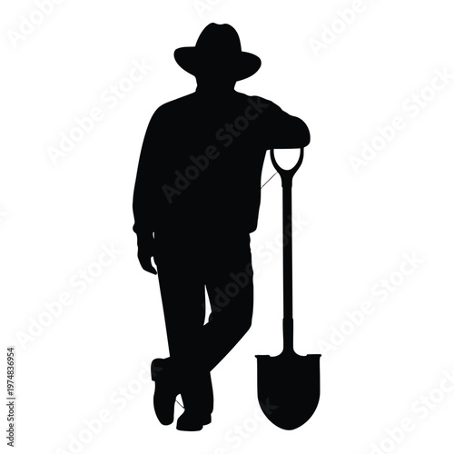 Silhouette of a farmer wearing a widebrimmed hat resting with a shovel leaning on his shoulder and leg crossed showing a relaxed pose representing rural work and agricultural lifestyle