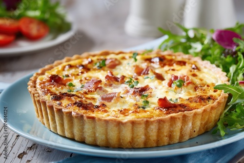 Quiche Lorraine with bacon, egg, and fresh salad for lunch