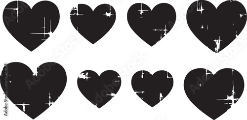 Black hearts with white scratches on plain background