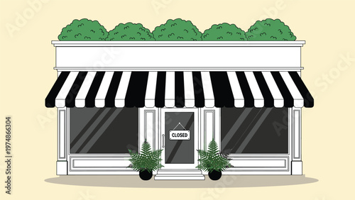 Exterior of a small shop with a black and white striped awning and a closed sign hanging on the front door between two large windows.