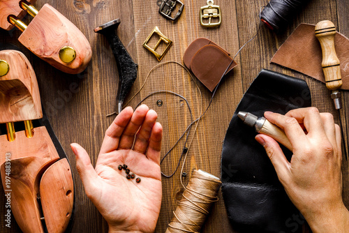 cobbler tools in workshop dark background top view