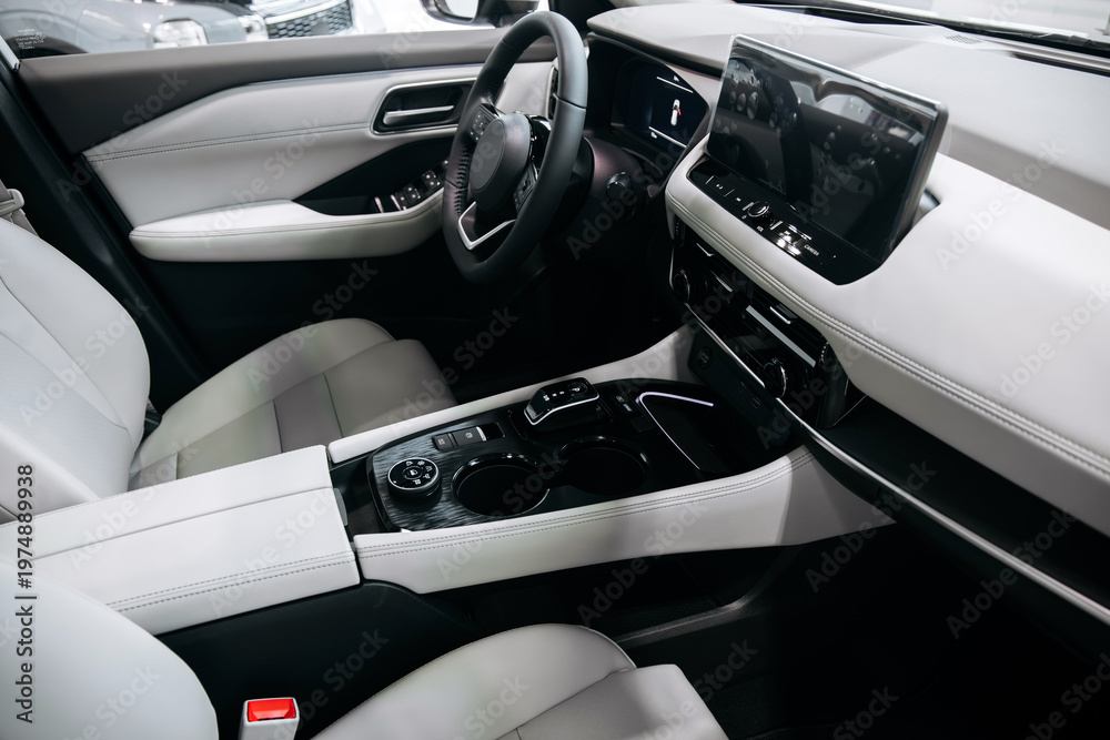 Fototapeta premium Modern automotive interior featuring a smart driving interface, leather seats, and a sleek dashboard design with a large touchscreen display and central console