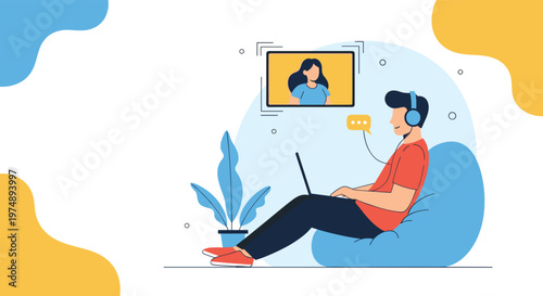 Man sitting in a bean bag chair having a video call with a woman on a screen while wearing his blue headphones.