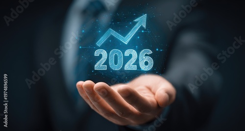 A hand holds a digital projection of a growing arrow and 2026