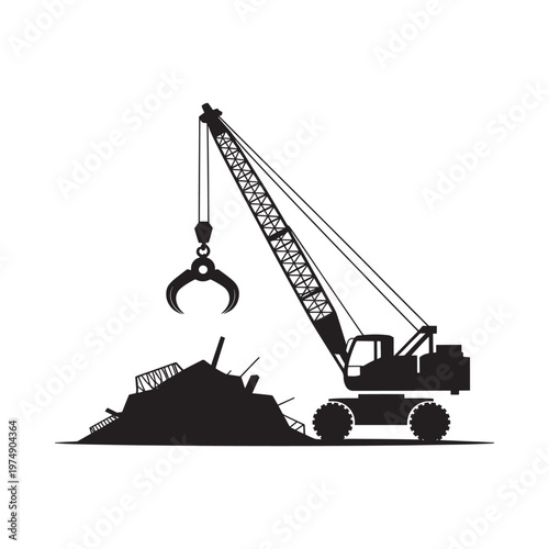 Silhouette of a crane lifting debris from a scrap pile