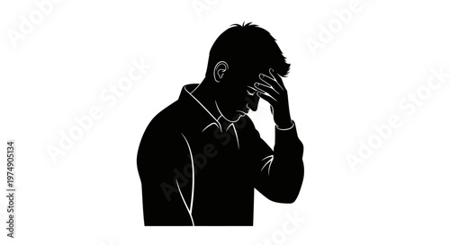 Silhouette of a man covering his face in despair or frustration