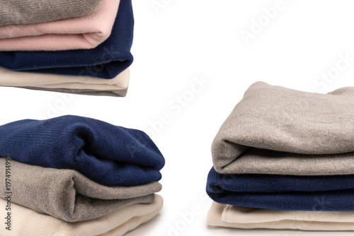 A group of warm sweaters isolated on a white background.