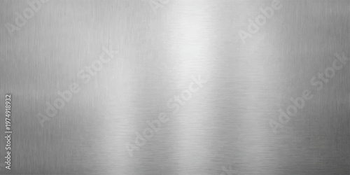 Polished stainless steel plate with a brushed metal texture featuring a shiny silver metallic surface and industrial titanium grey pattern for a sleek aluminum backdrop
