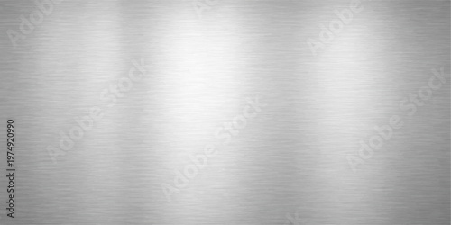 A polished stainless steel plate featuring a brushed metal texture and silver metallic pattern creates a shiny industrial aluminum surface for modern grey material backgrounds