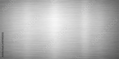 A polished silver stainless steel sheet features a shiny brushed metal texture on an industrial aluminum surface with a gray metallic pattern for a sleek material background design