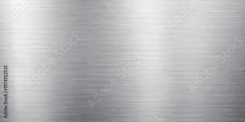 A polished silver stainless steel plate features a brushed metal texture on a shiny grey industrial aluminum surface with a smooth metallic pattern and subtle reflection across the material sheet