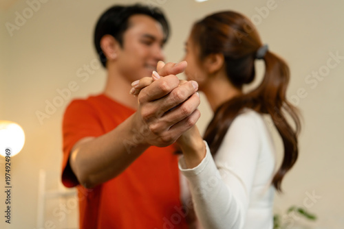 Close-Up of Loving Couple Holding Hands and Dancing at Home