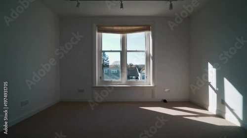 Empty bright room interior with sunlight through window, minimal modern apartment space