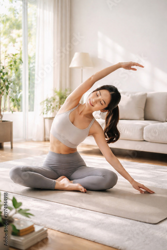 Serene Yoga Practice: A young woman performs yoga stretches in a cozy, sunlit living room, demonstrating tranquility and well-being. 