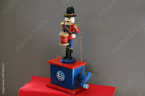 This skillfully crafted wooden drummer figurine is presented in vibrant, saturated colors. 
