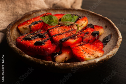 Savory Strawberries with Balsamic Cream and Black Pepper on Handmade Ceramic Plate