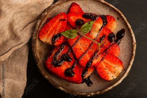 Savory Strawberries with Balsamic Cream and Black Pepper on Handmade Ceramic Plate